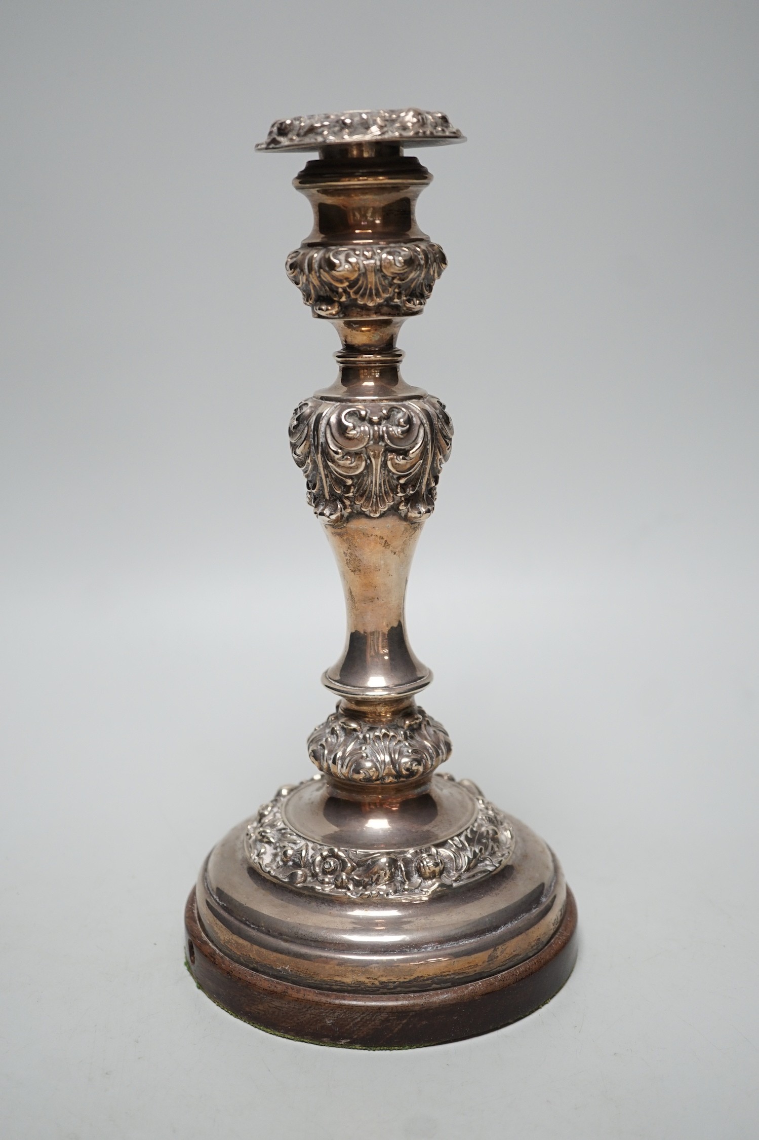 A George IV silver candlestick, Thomas Blagden & Co, Sheffield, 1822, now mounted on a later wooden base, with drill hole for electricity??, overall height 26.9cm.
